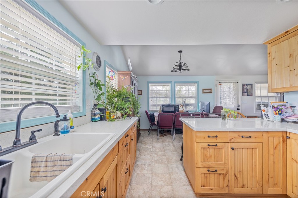 5072 Tip Top Road Mariposa, CA 95338 - Photo 6 of 41 a kitchen that has a lot of cabinets in it and wooden floor