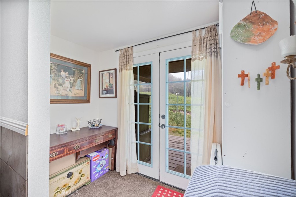 5072 Tip Top Road Mariposa, CA 95338 - Photo 10 of 41 a bedroom with a bed and a window