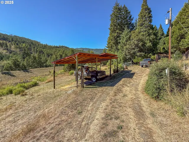 a view of a car park on the side of the road
