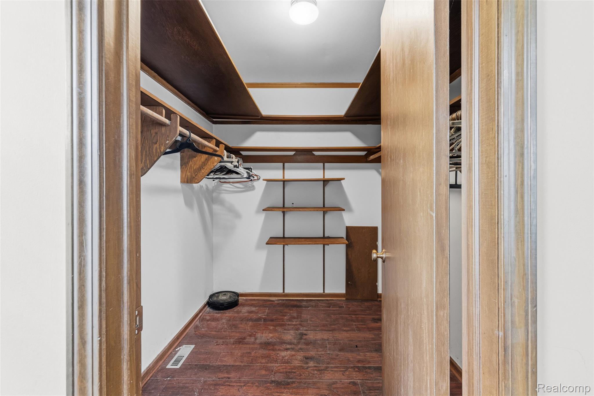 3432 South State Road Davison, MI 48423 - Photo 21 of 58 Walk in closet featuring dark wood finished floors
