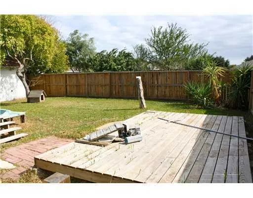a view of a backyard with wooden floor