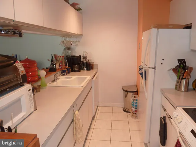 a room with sink a washer and dryer