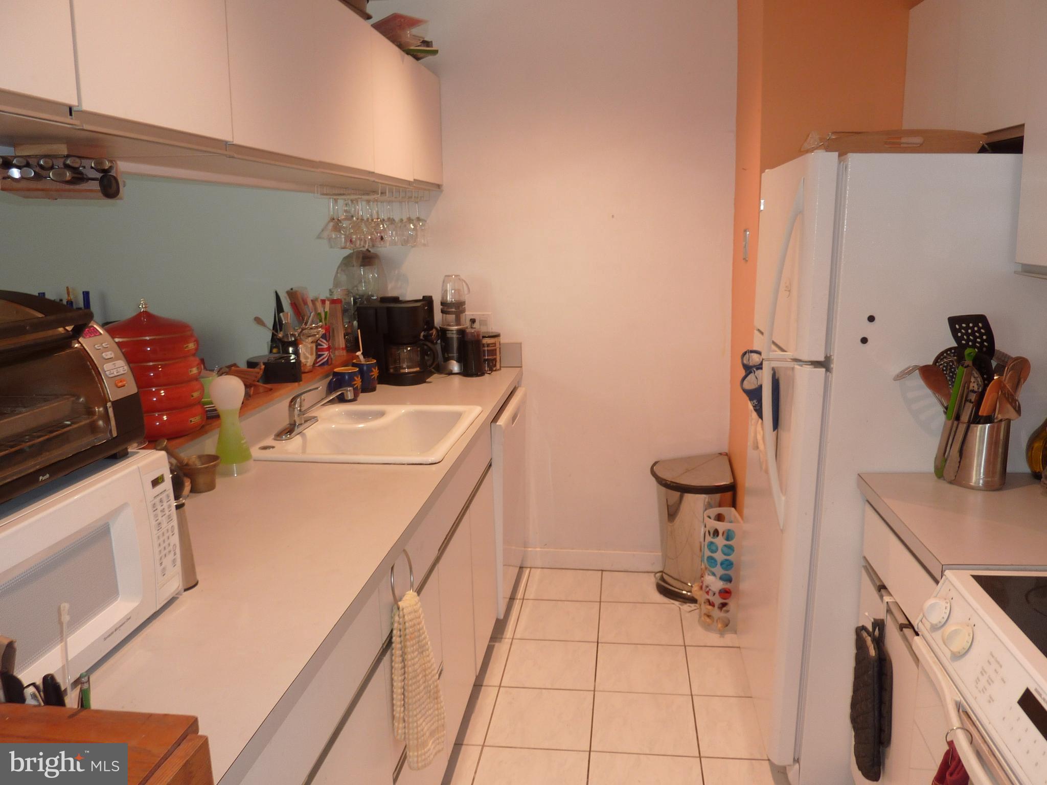 11 North 2nd Street, Unit 306 Philadelphia, PA 19106 - Photo 13 of 42 a room with sink a washer and dryer