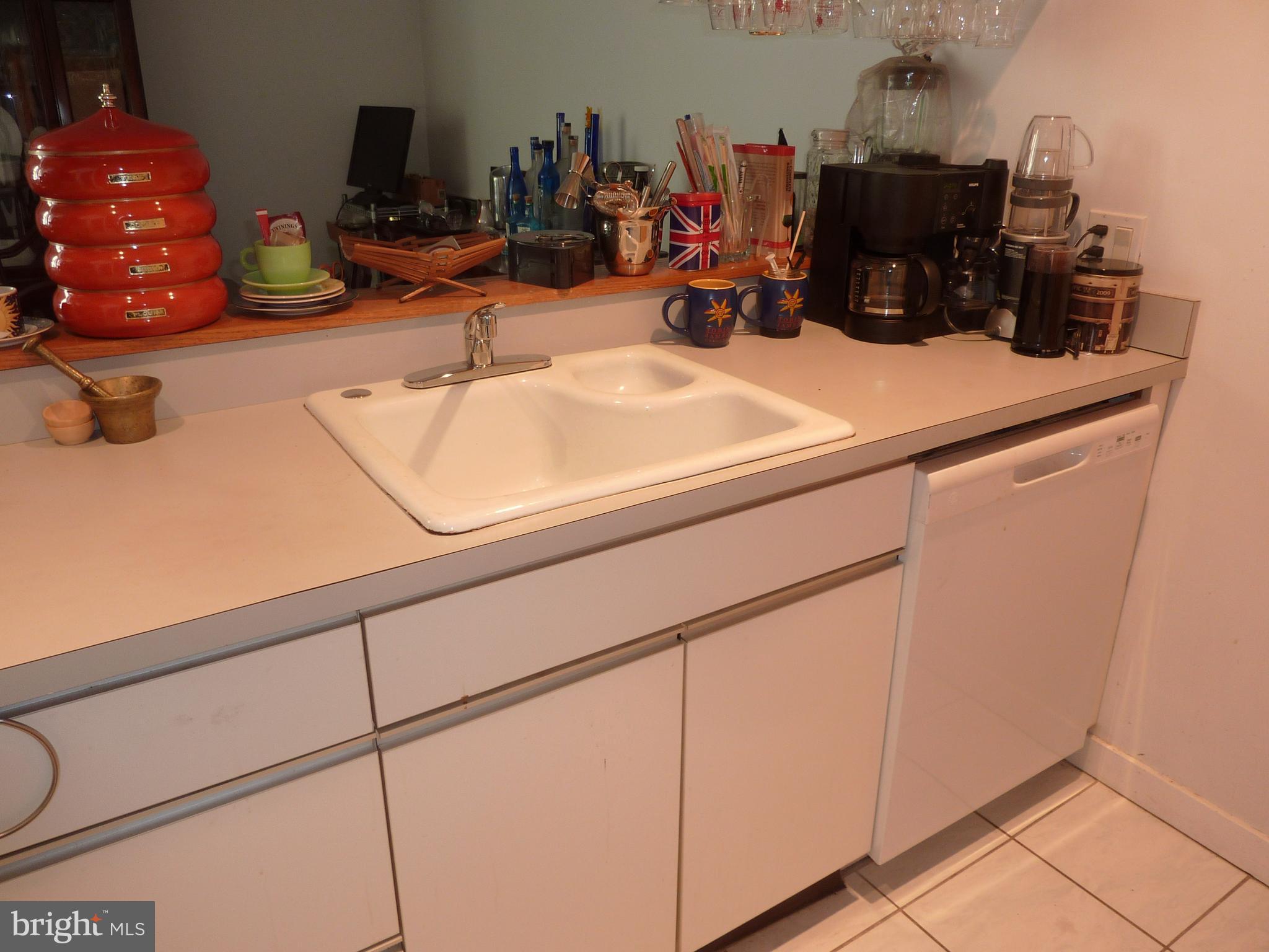 11 North 2nd Street, Unit 306 Philadelphia, PA 19106 - Photo 15 of 42 a kitchen with a sink and a stove top oven