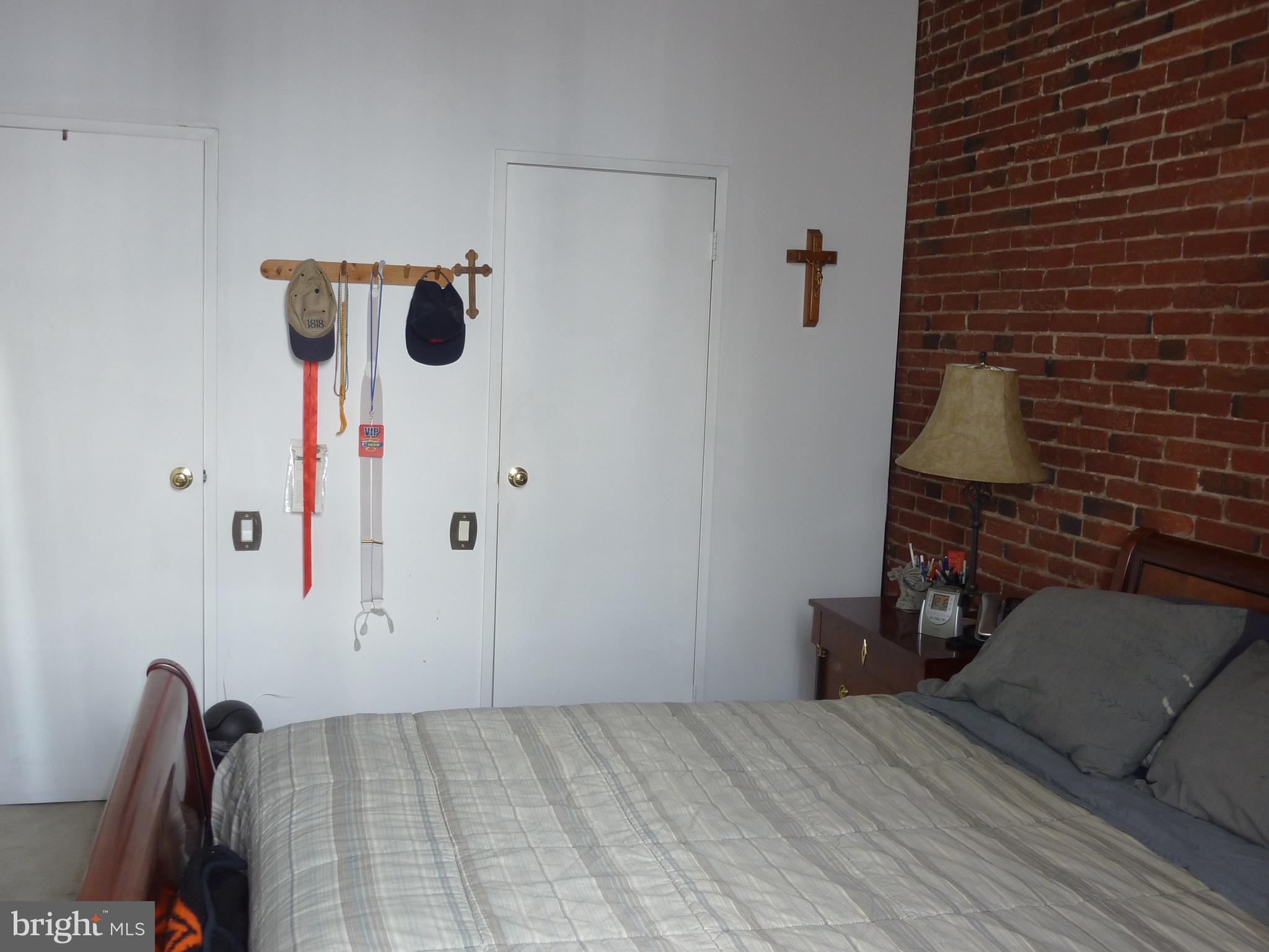 11 North 2nd Street, Unit 306 Philadelphia, PA 19106 - Photo 26 of 42 a bedroom with a bed and a mirror