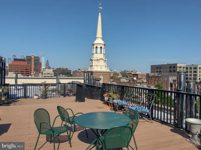 a terrace of a house with outdoor seating