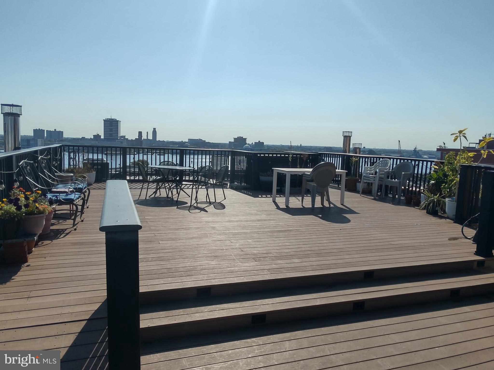 11 North 2nd Street, Unit 306 Philadelphia, PA 19106 - Photo 40 of 42 a view of a roof deck with two chairs and wooden floor