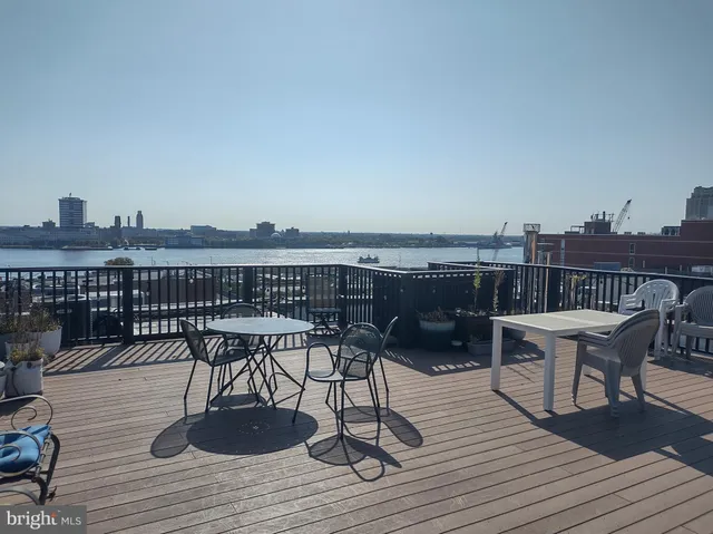 a view of a balcony with two chairs