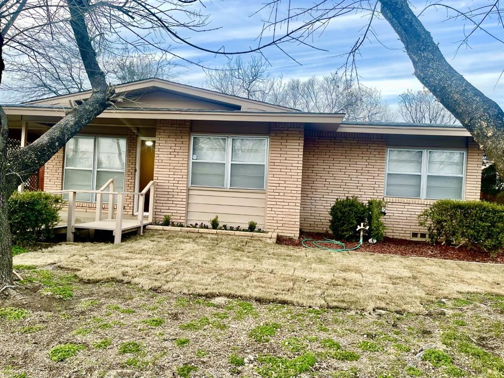 a house with yard in front of it