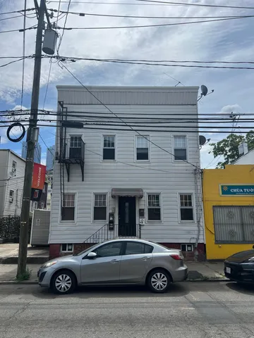 a car parked in front of a house