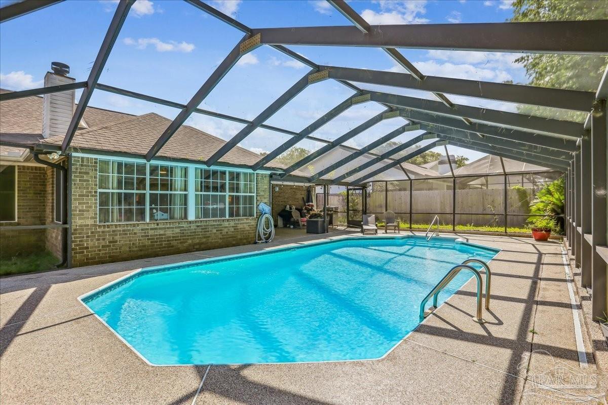 a view of a swimming pool with a porch