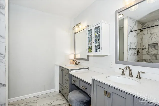 a bathroom with a sink and a mirror
