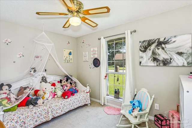 a bedroom with furniture and a bed