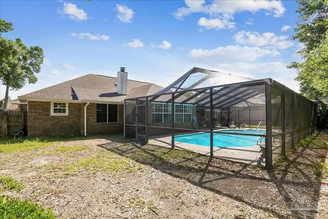 a house view with a backyard space