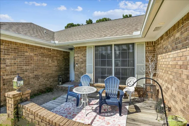 a front view of a house with table and chairs