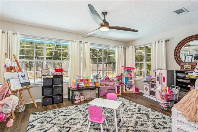 a living room with lots of furniture and a flat screen tv