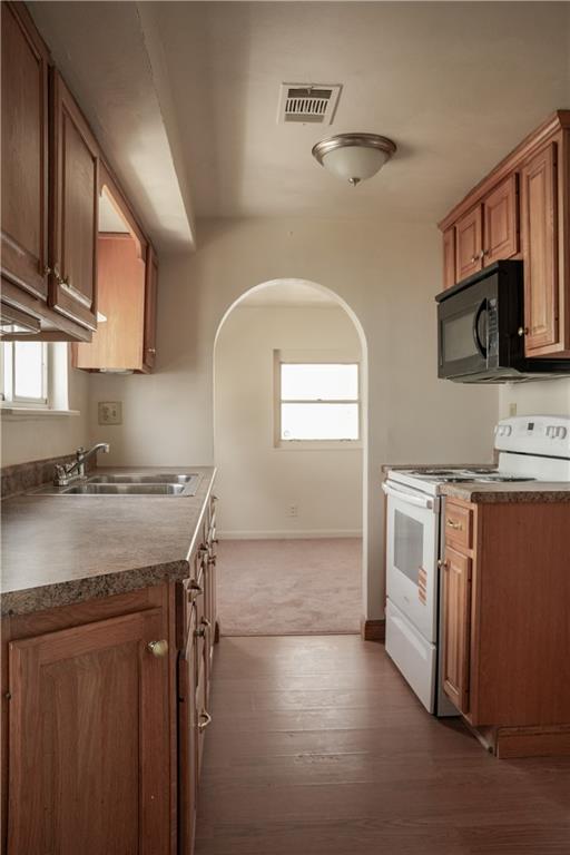 214 12th Street Monaca, PA 15061 - Photo 11 of 20 a kitchen with stainless steel appliances granite countertop a sink stove and microwave