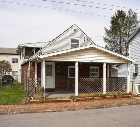 214 12th Street Monaca, PA 15061 - Photo 2 of 20 a front view of a house with a porch