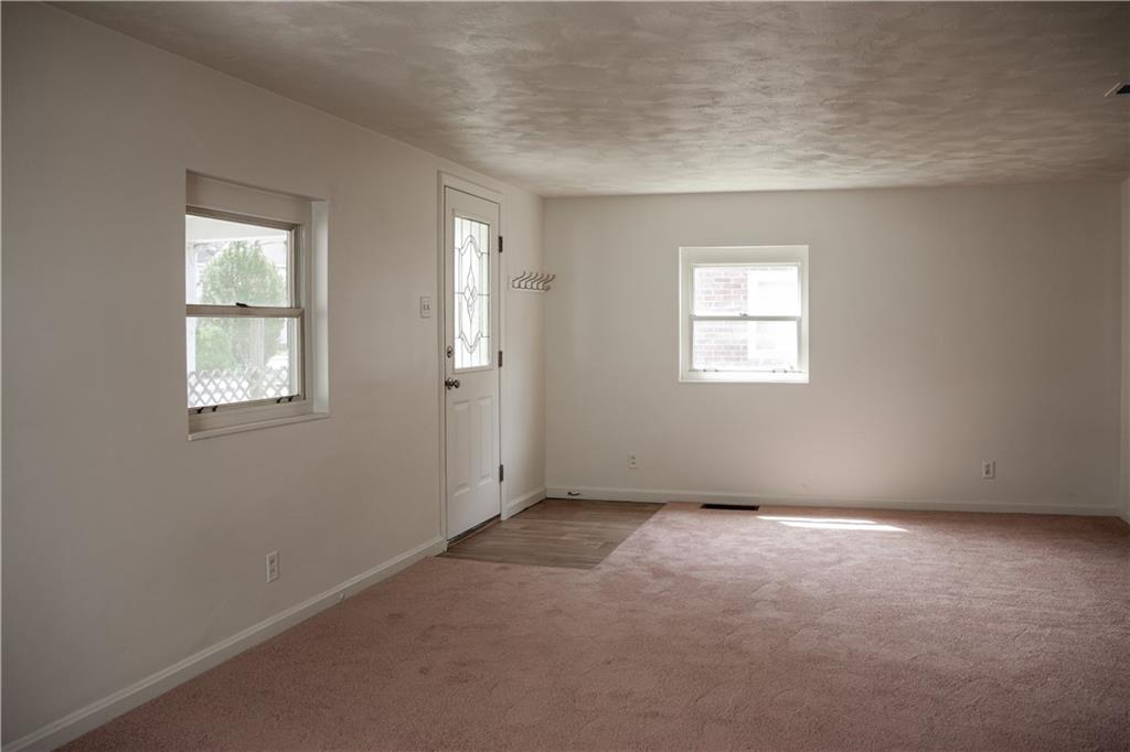214 12th Street Monaca, PA 15061 - Photo 4 of 20 an empty room with windows