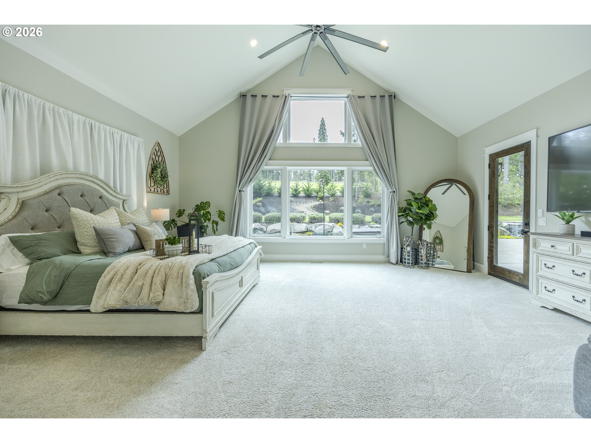 32568 Deberry Road Creswell, OR 97426 - Photo 12 of 41 a spacious bedroom with a bed and a large window