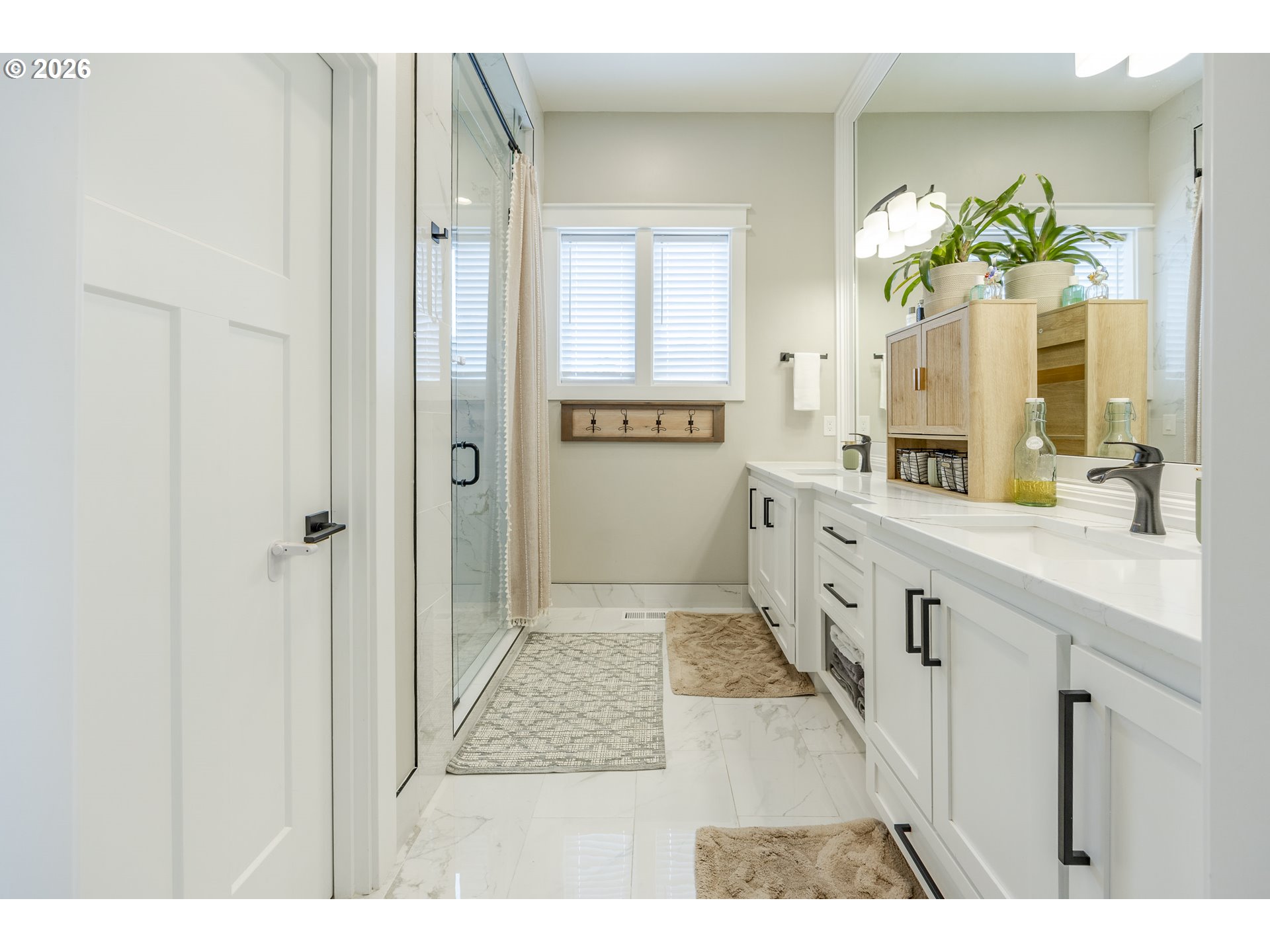 32568 Deberry Road Creswell, OR 97426 - Photo 19 of 41 a spacious bathroom with a double vanity sink a mirror and a shower