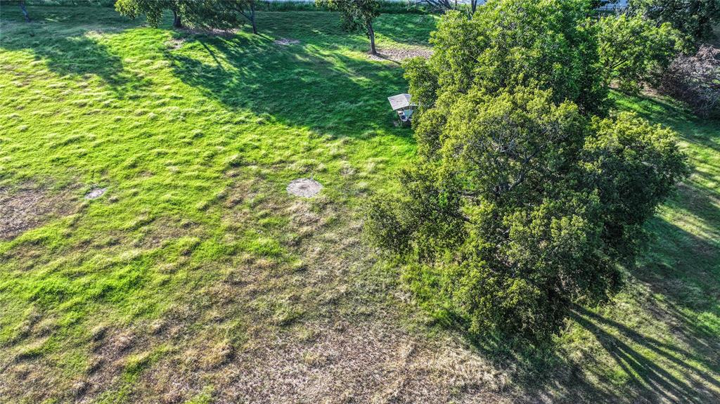 708 West Howell Street St. Jo, TX 76265 - Photo 11 of 14 a view of a lush green forest