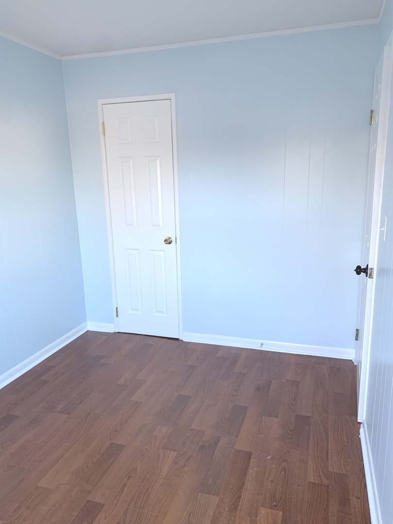 820 Post Lane Streamwood, IL 60107 - Photo 10 of 10 a view of an empty room with wooden floor