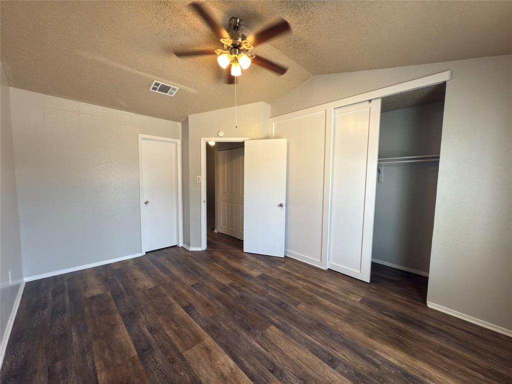 2250 Aspen Drive Dallas, TX 75227 - Photo 12 of 22 a view of an empty room with wooden floor