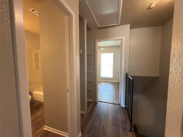 a view of a bathroom with a sink and a mirror