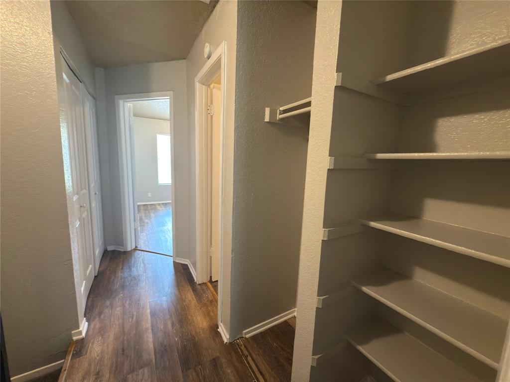 2250 Aspen Drive Dallas, TX 75227 - Photo 19 of 22 a view of hallway with wooden floor