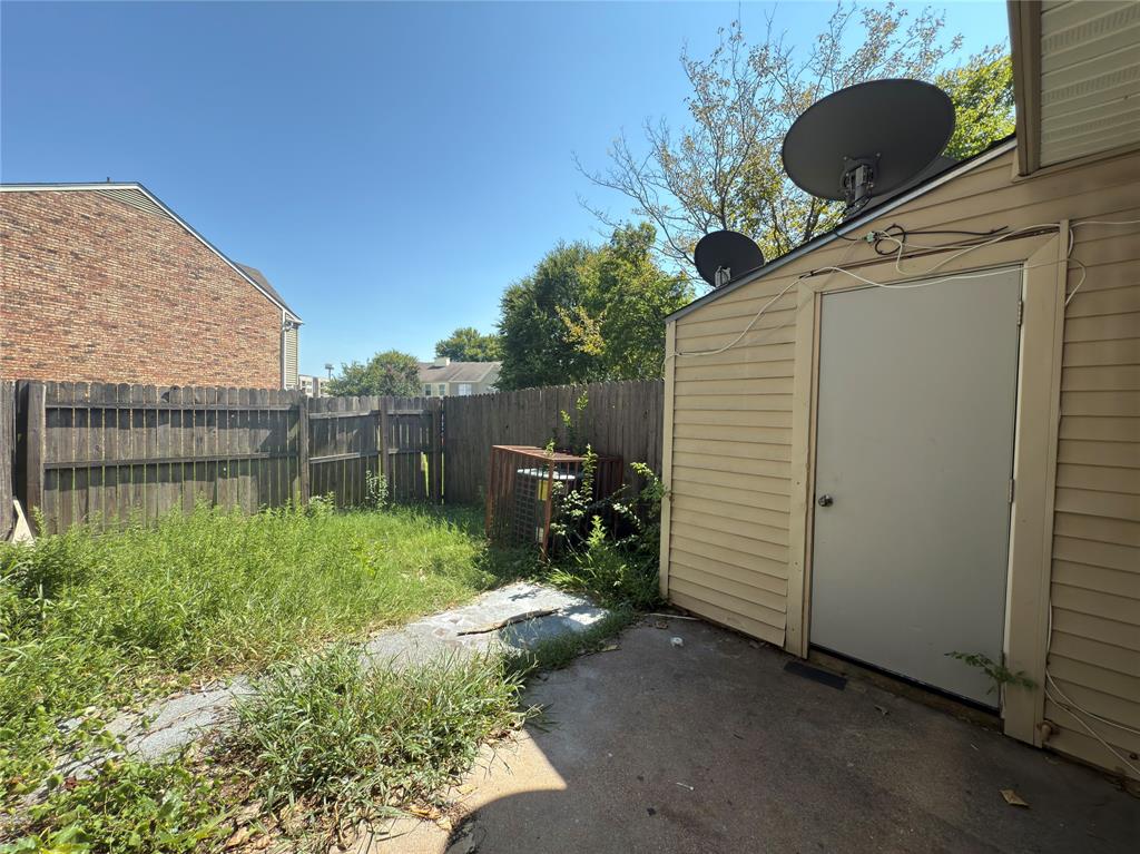 2250 Aspen Drive Dallas, TX 75227 - Photo 22 of 22 a backyard of a house with a tub and trees