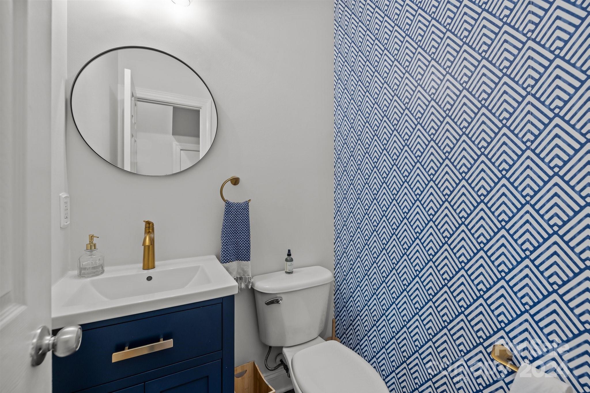 1106 Dove Trace Tega Cay, SC 29708 - Photo 11 of 38 a bathroom with a toilet a sink and a mirror