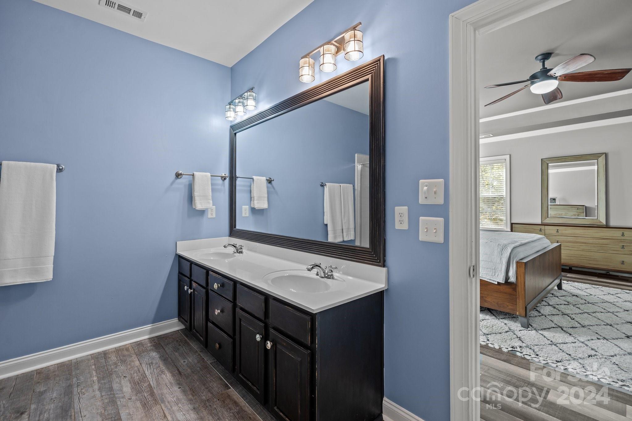 1106 Dove Trace Tega Cay, SC 29708 - Photo 17 of 38 a bathroom with a sink a mirror and a toilet