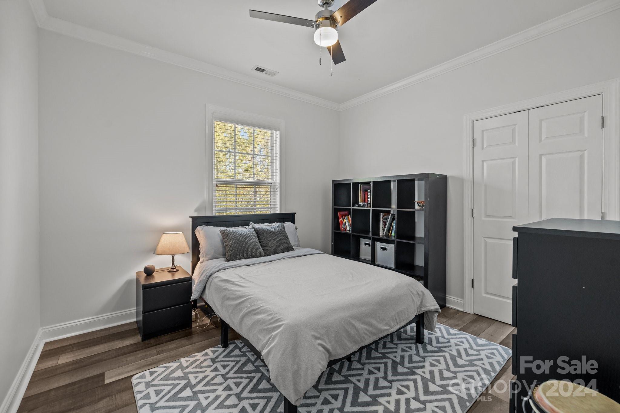 1106 Dove Trace Tega Cay, SC 29708 - Photo 21 of 38 a bedroom with a bed and walk in closet