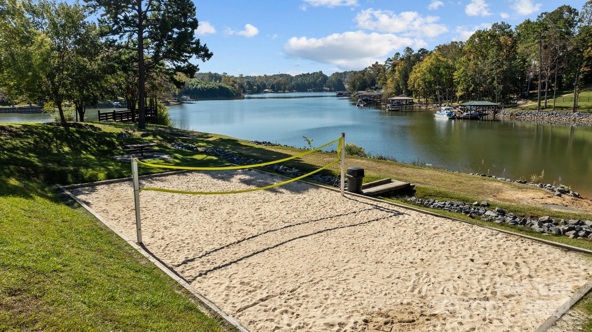 1106 Dove Trace Tega Cay, SC 29708 - Photo 37 of 38 a view of a lake with boats and trees in the background