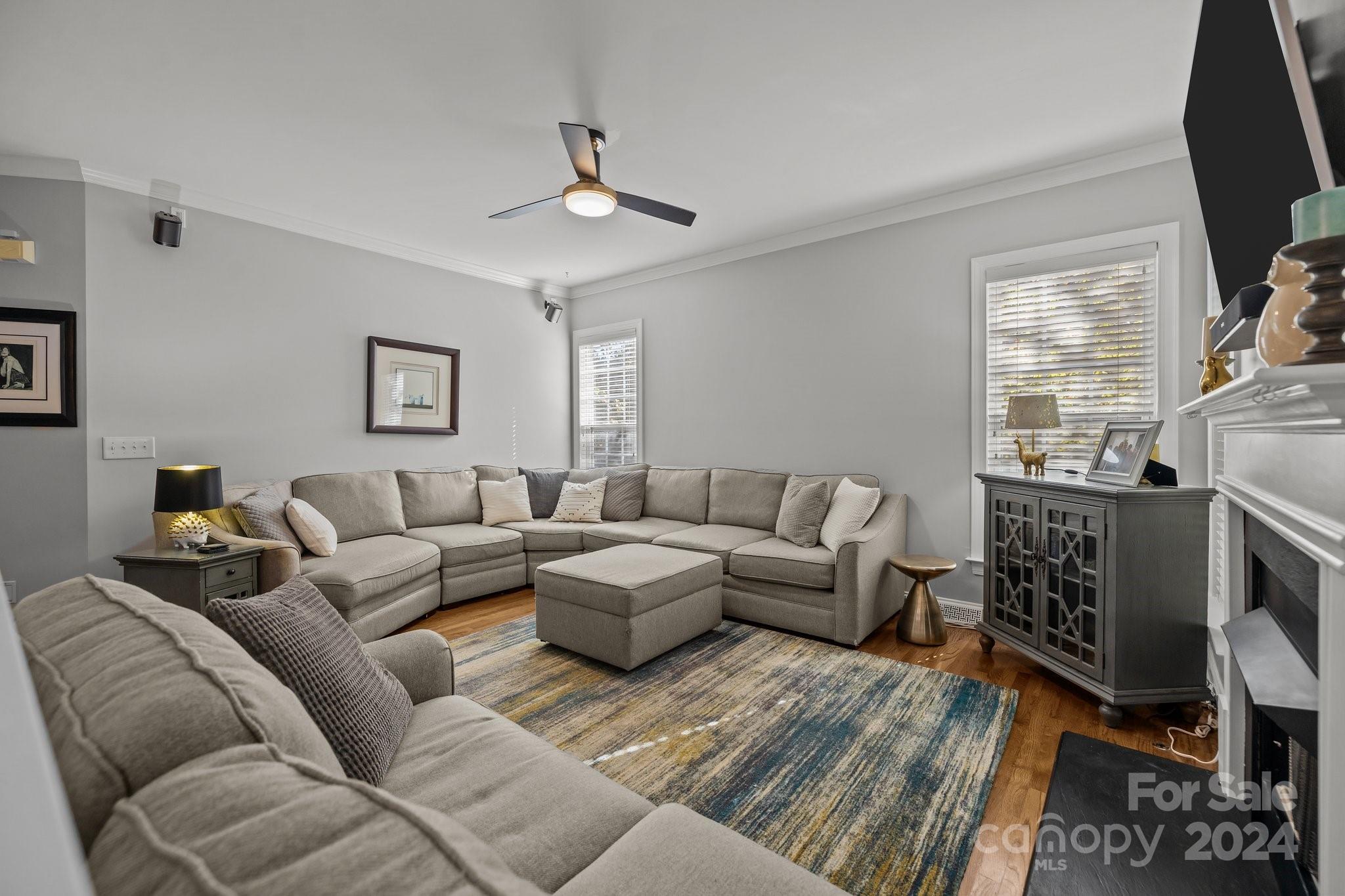 1106 Dove Trace Tega Cay, SC 29708 - Photo 5 of 38 a living room with furniture a fireplace and a flat screen tv