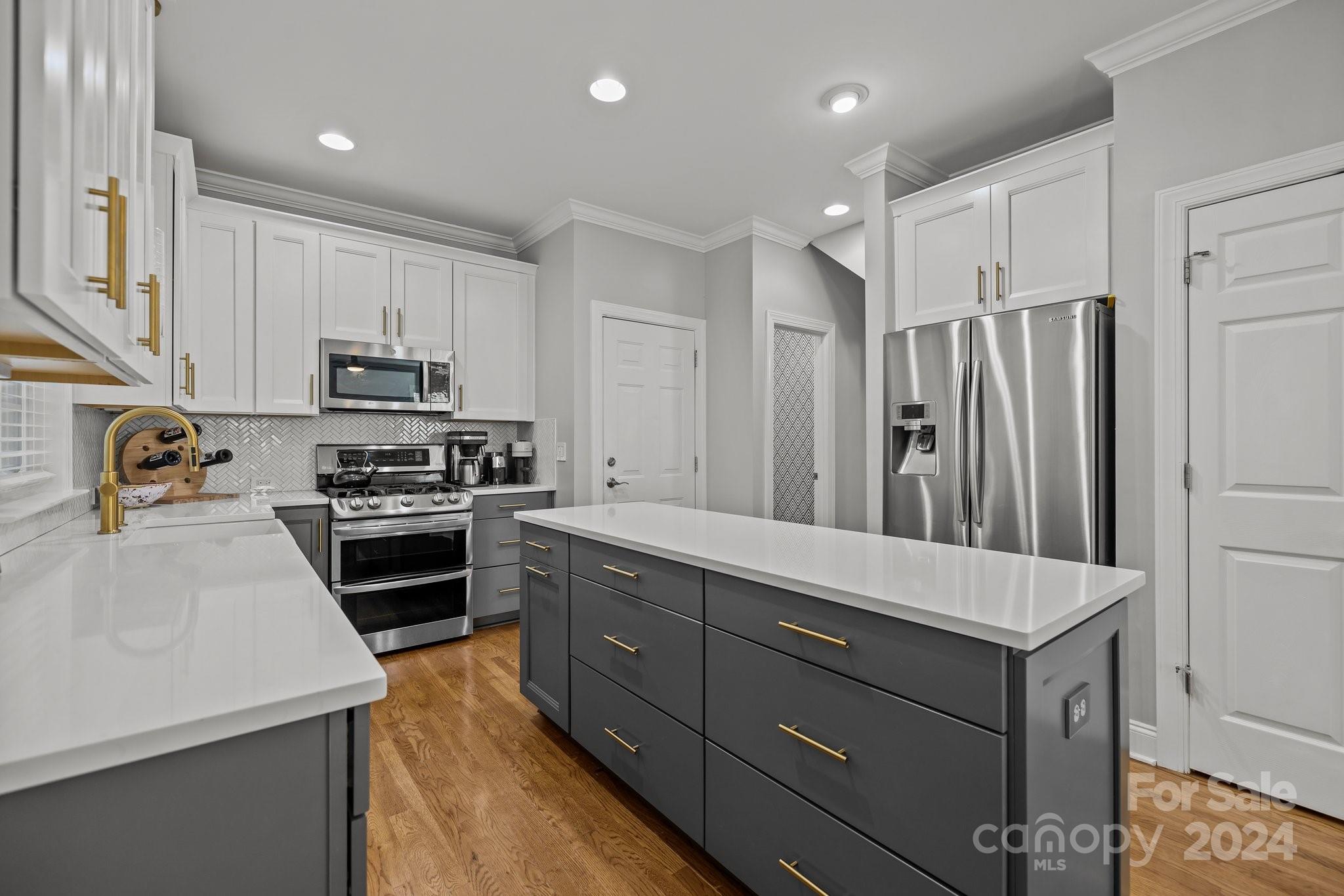 1106 Dove Trace Tega Cay, SC 29708 - Photo 8 of 38 a kitchen with a refrigerator stove and sink
