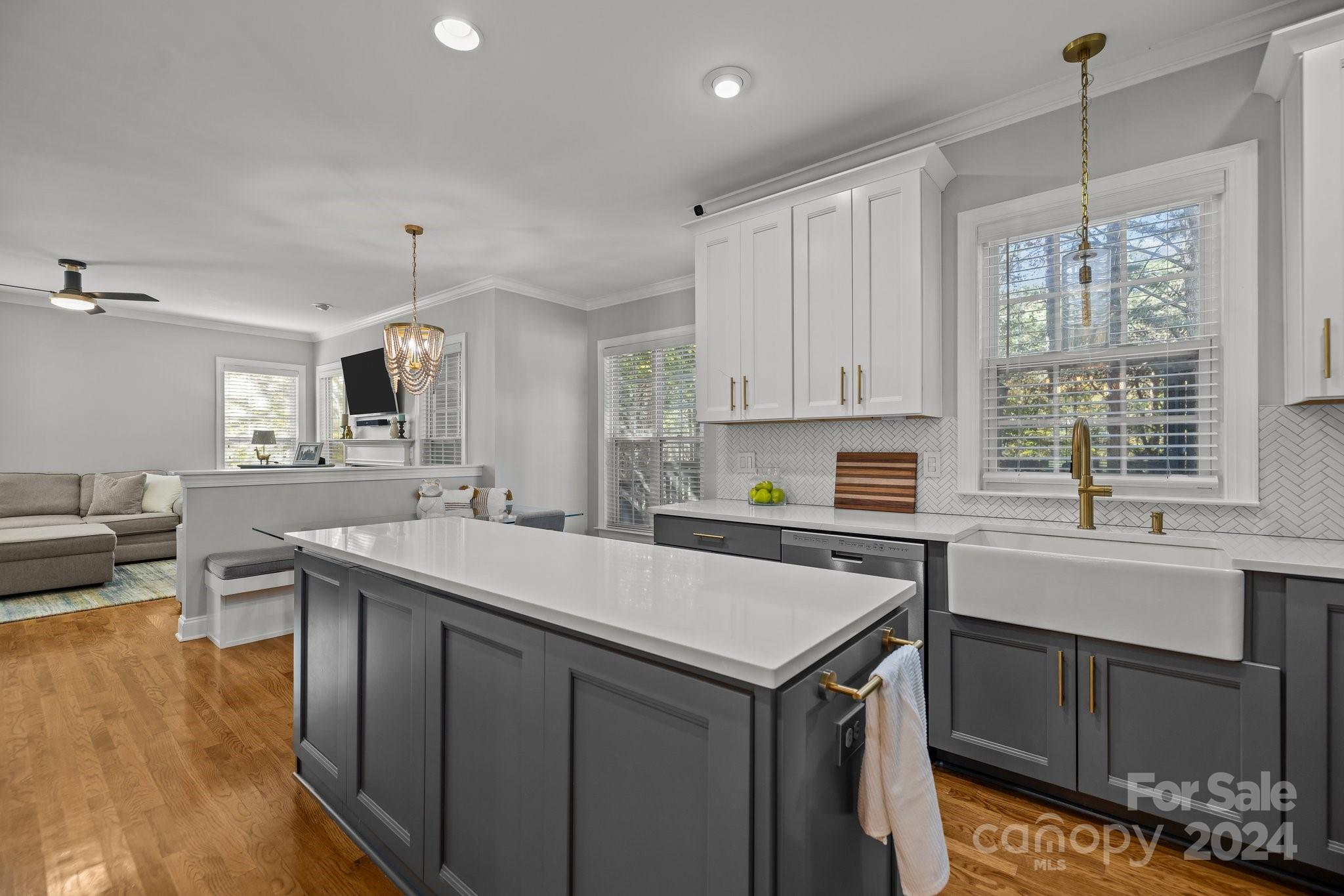 1106 Dove Trace Tega Cay, SC 29708 - Photo 10 of 38 a kitchen with a sink window and cabinets