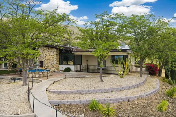 a view of a house with backyard