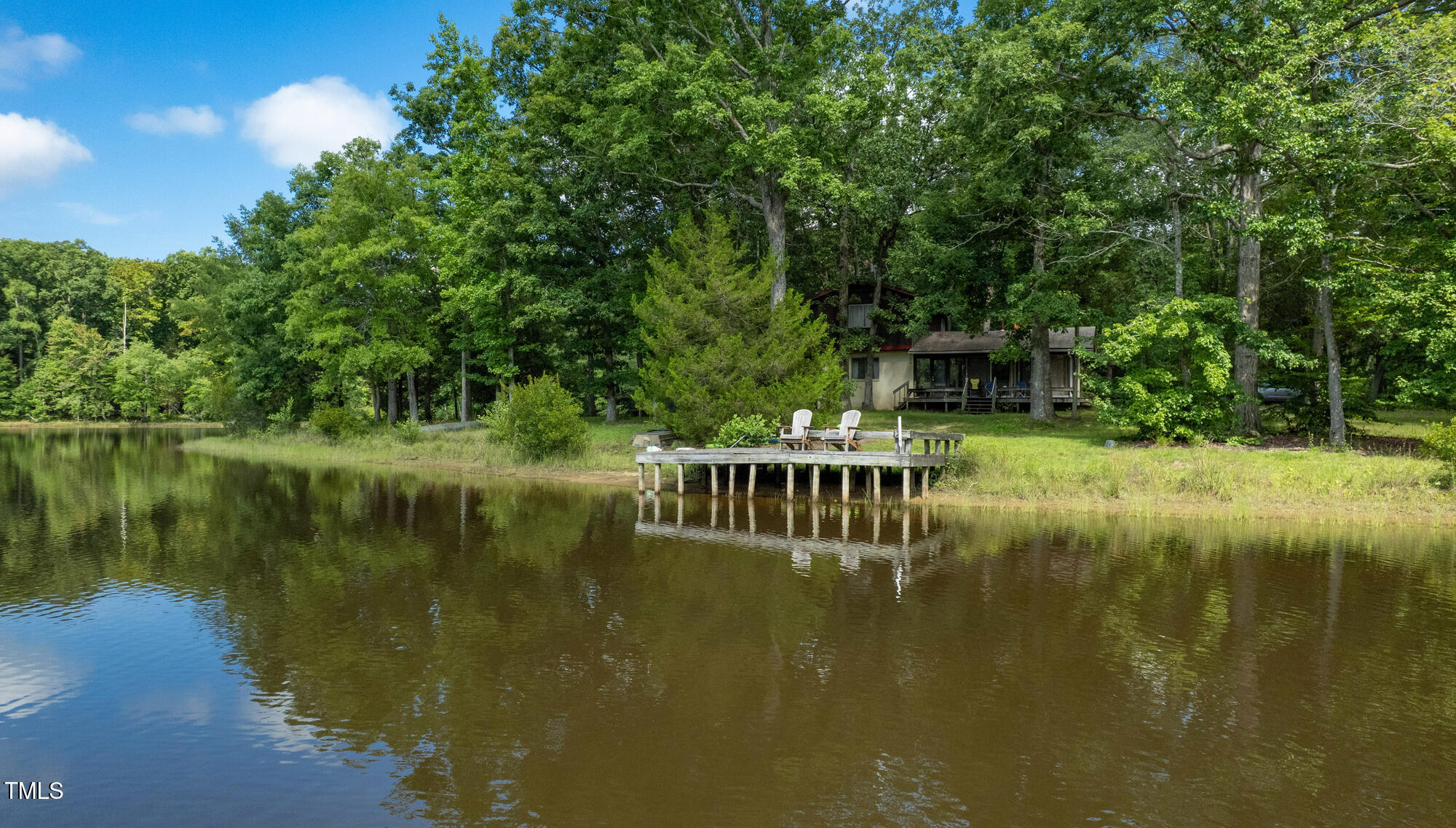 2918-3000 Chestnut Ridge Church Road Efland, NC 27243 - Photo 16 of 23 a view of a lake with a house in the background