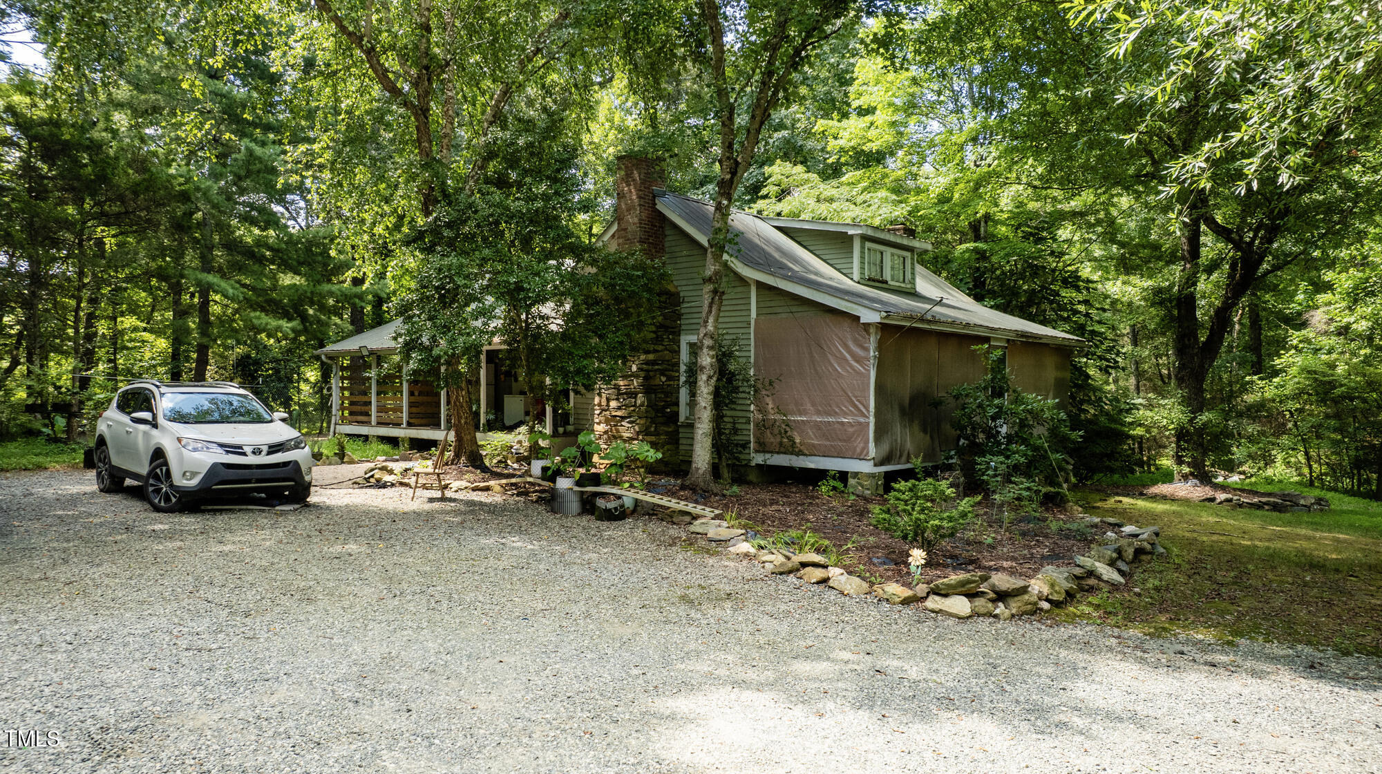 2918-3000 Chestnut Ridge Church Road Efland, NC 27243 - Photo 20 of 23 a view of backyard with a car parked in it