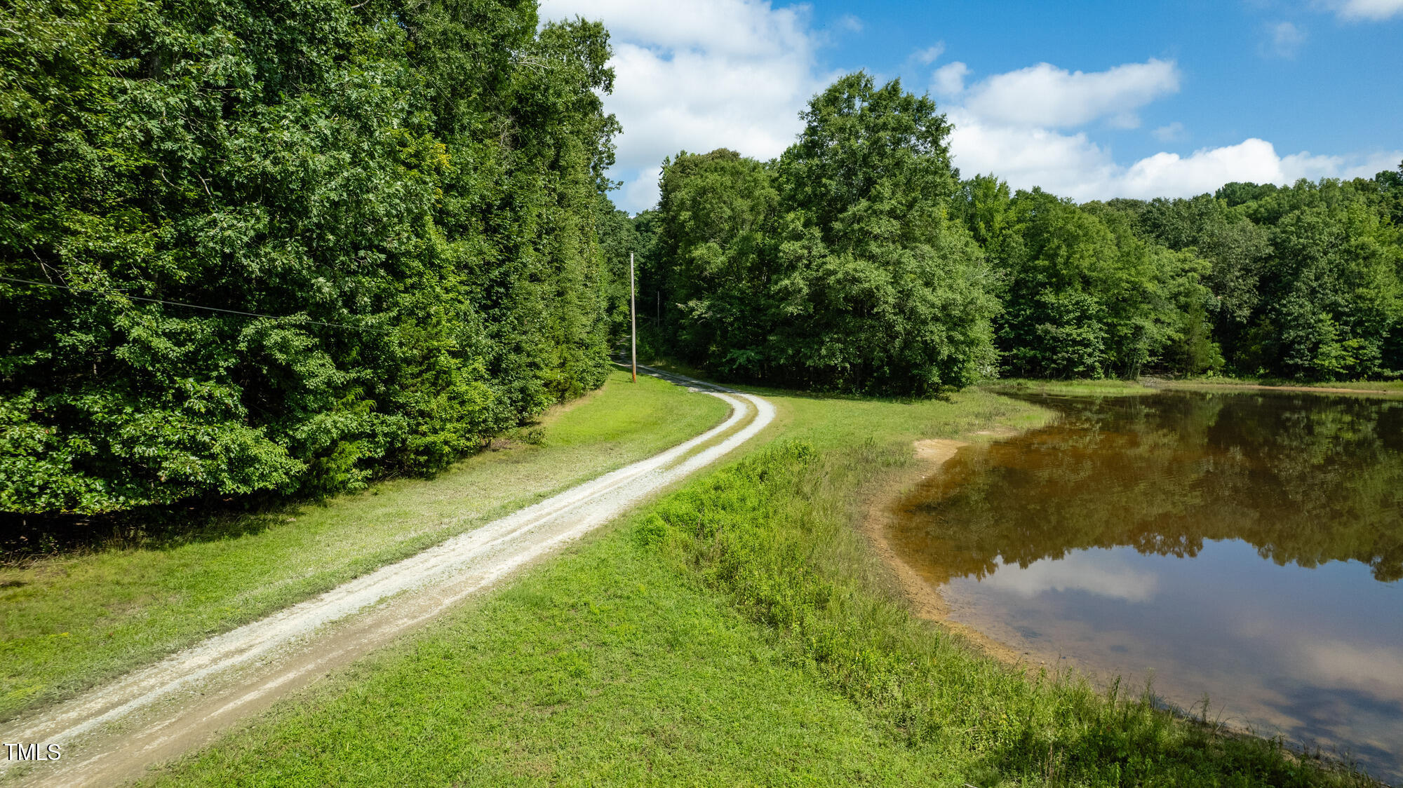 2918-3000 Chestnut Ridge Church Road Efland, NC 27243 - Photo 6 of 23 a view of a lake with a yard