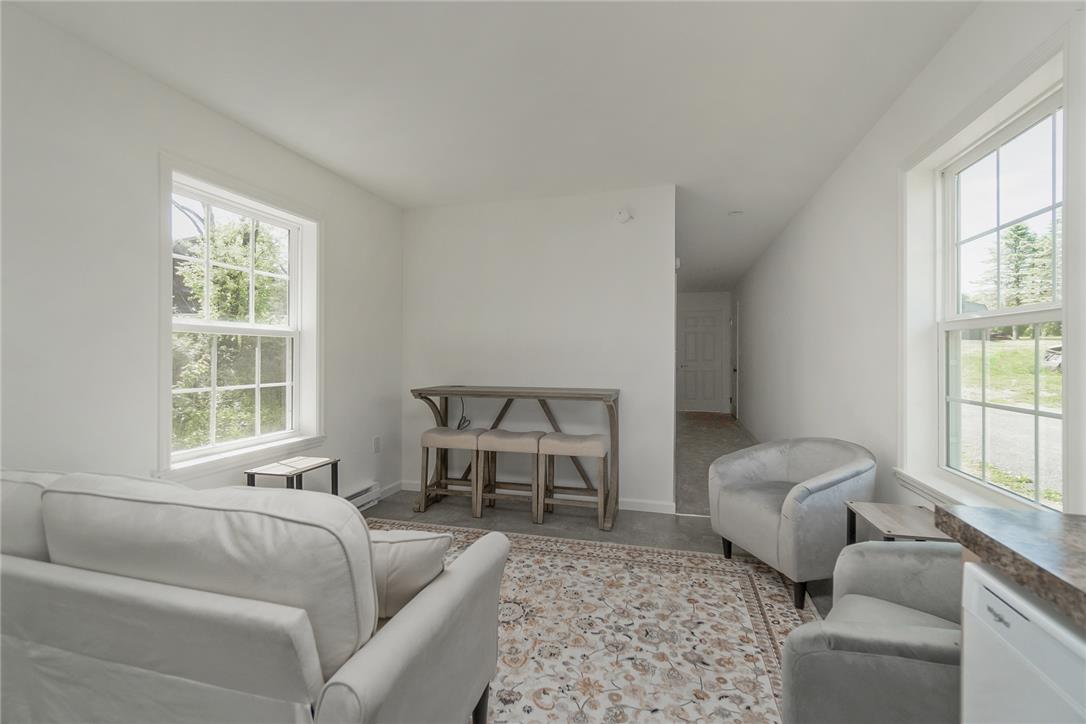 624 Main Road Lehighton, PA 18235 - Photo 14 of 42 Natural light floods this inviting living space, providing a serene ambiance for relaxation.
