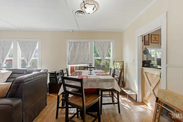 a view of a dining room with furniture window and outside view