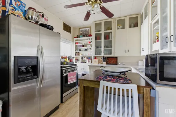 a kitchen with a stove and a cabinets