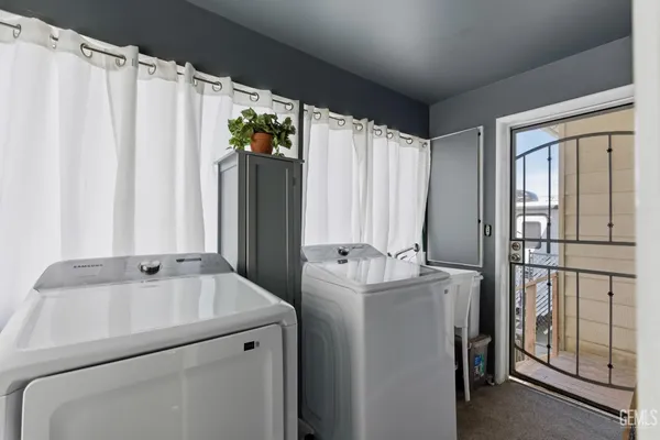 a bed room with a bed and a television