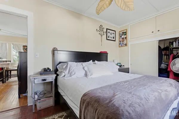 a bedroom with a bed and cabinets