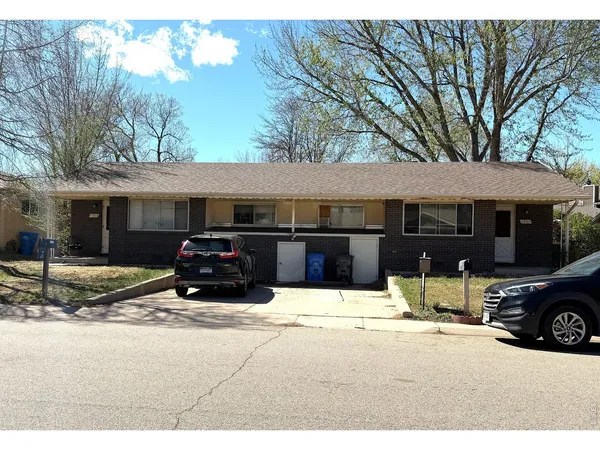 a car parked in front of a house