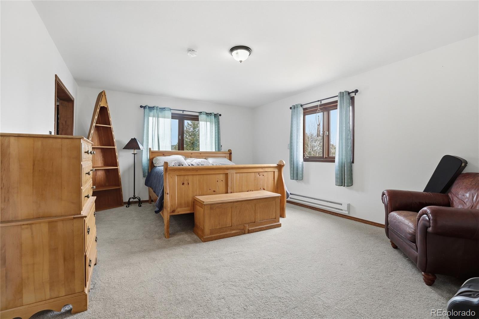 9225 Sandy Lane Conifer, CO 80433 - Photo 5 of 45 a room with furniture and a window