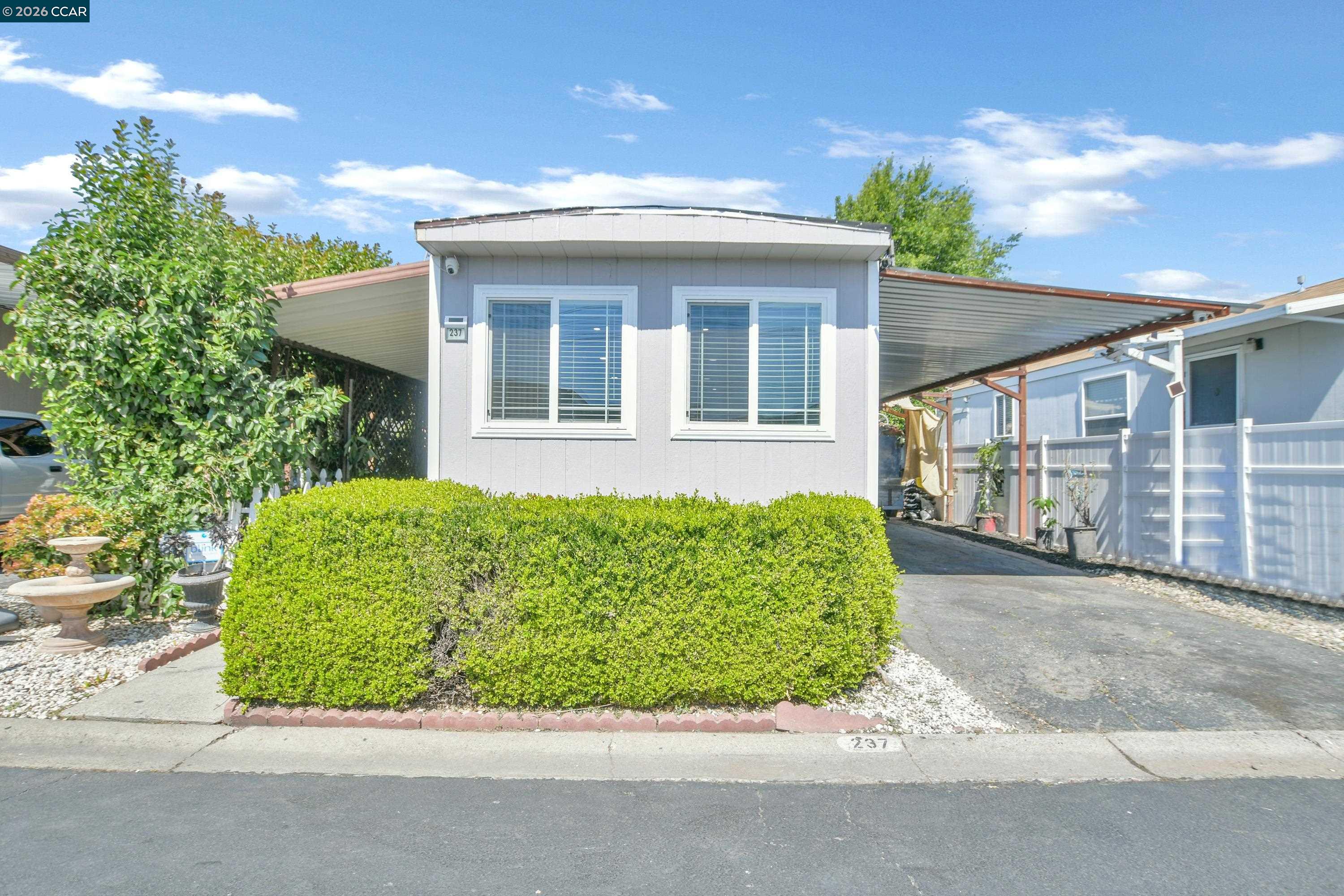 237 Orangevale Pittsburg, CA 94565 - Photo 2 of 21 front view of a house with a garden